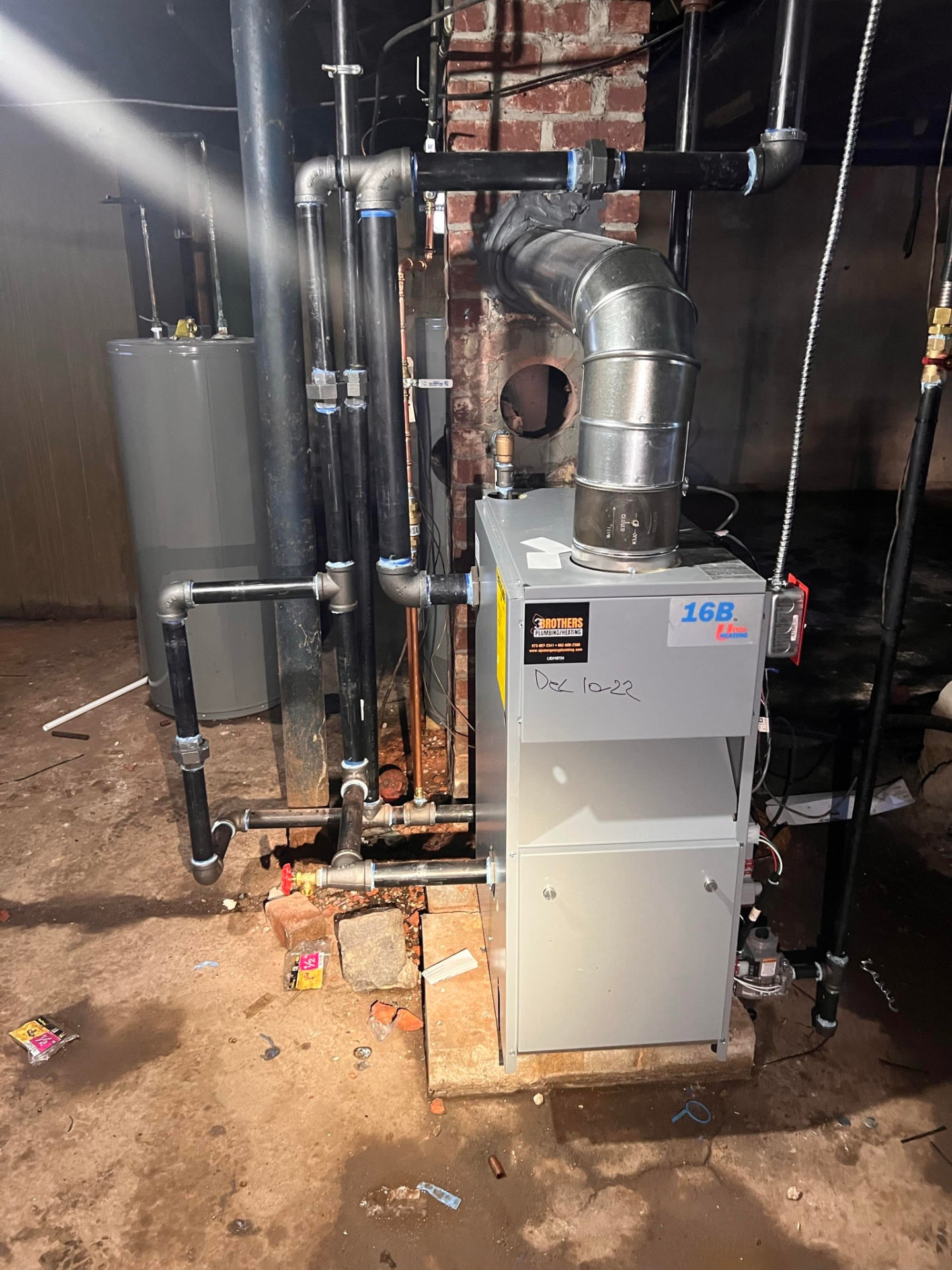 Gas boiler and flue pipe replaced next to an existing water heater